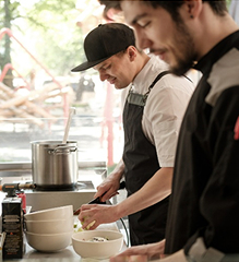Two chefs preparing a meal
